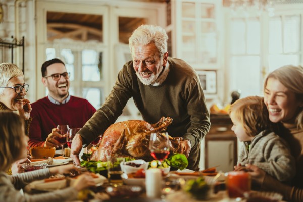 family-sits-down-for-Thanksgiving-dinner.jpg